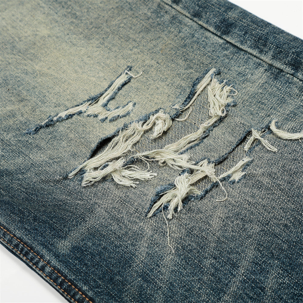 Vaqueros de pierna ancha de denim desgastado y lavado vintage