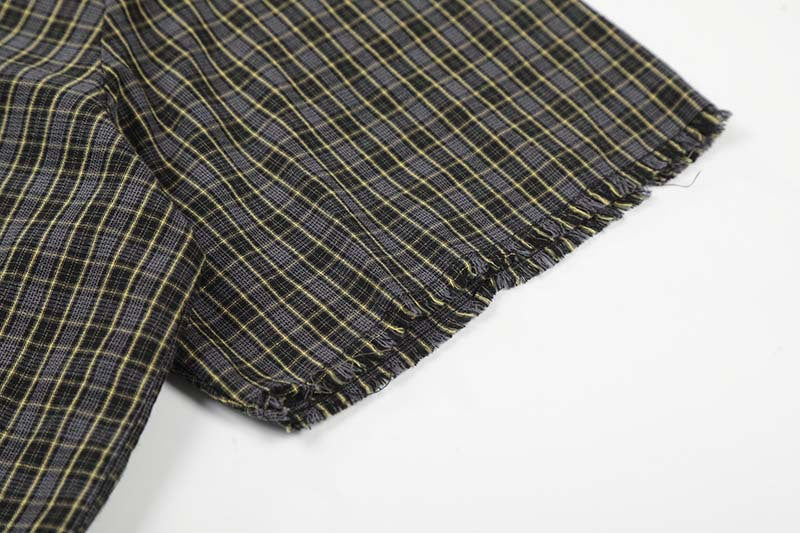 Camisa de manga corta a cuadros desgastada