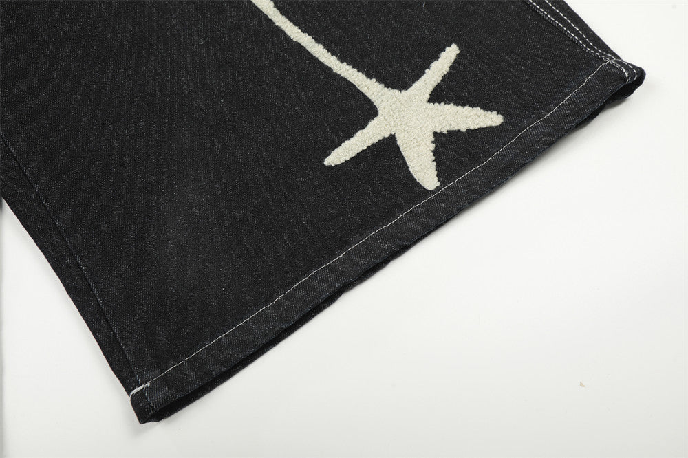 Pantalón corto vaquero de pernera ancha con estrellas bordadas