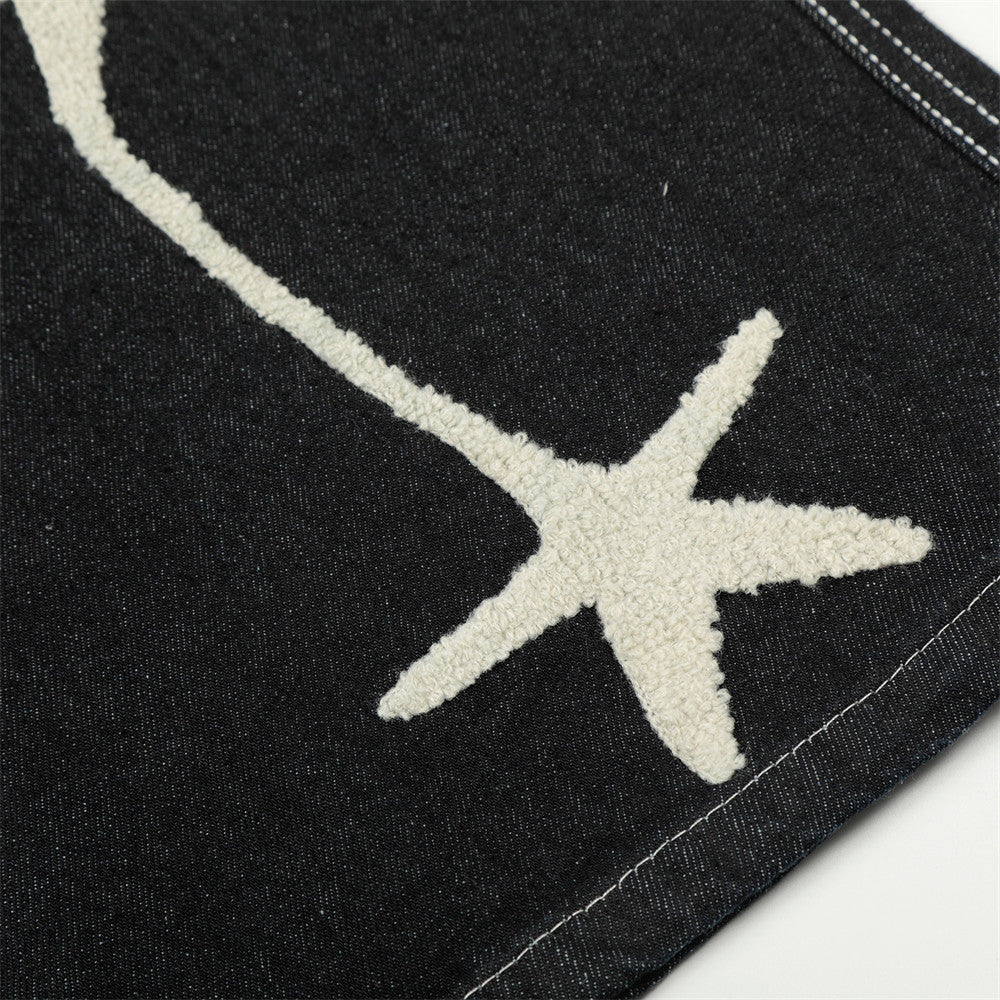 Pantalón corto vaquero de pernera ancha con estrellas bordadas
