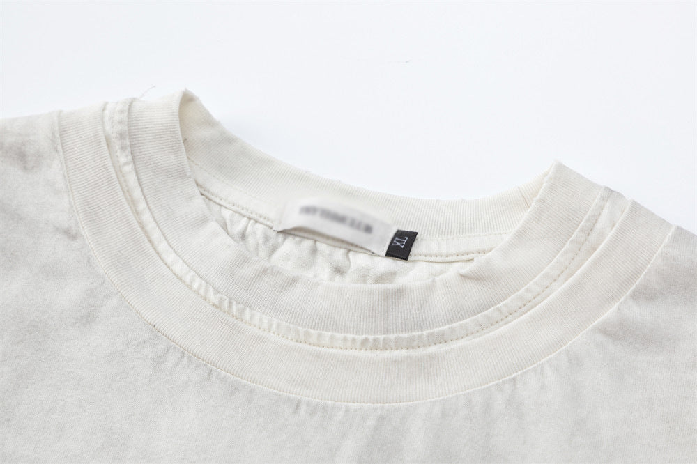 Camiseta estampada con texto descolorido