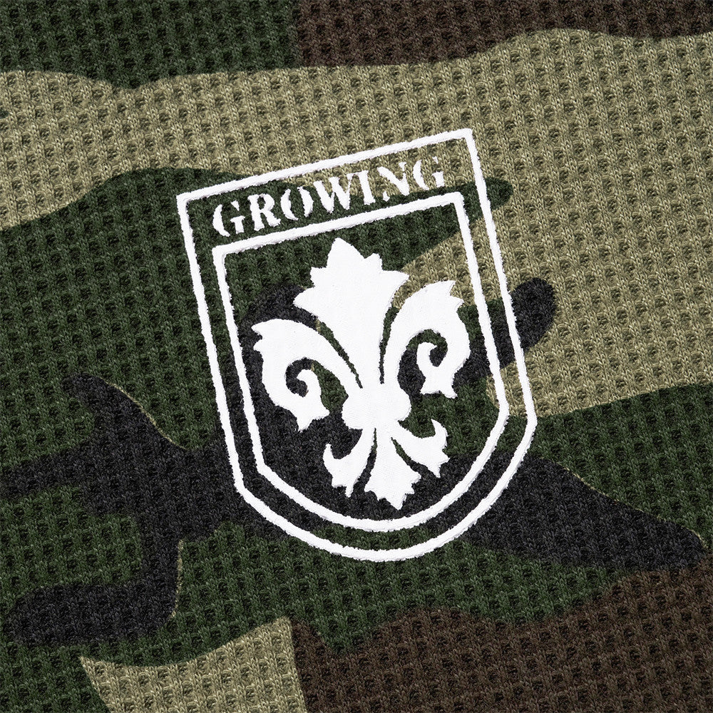 Blusa de manga larga de punto de gofre con estampado de camuflaje