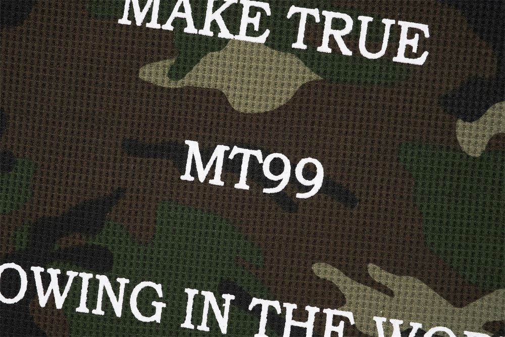 Blusa de manga larga de punto de gofre con estampado de camuflaje