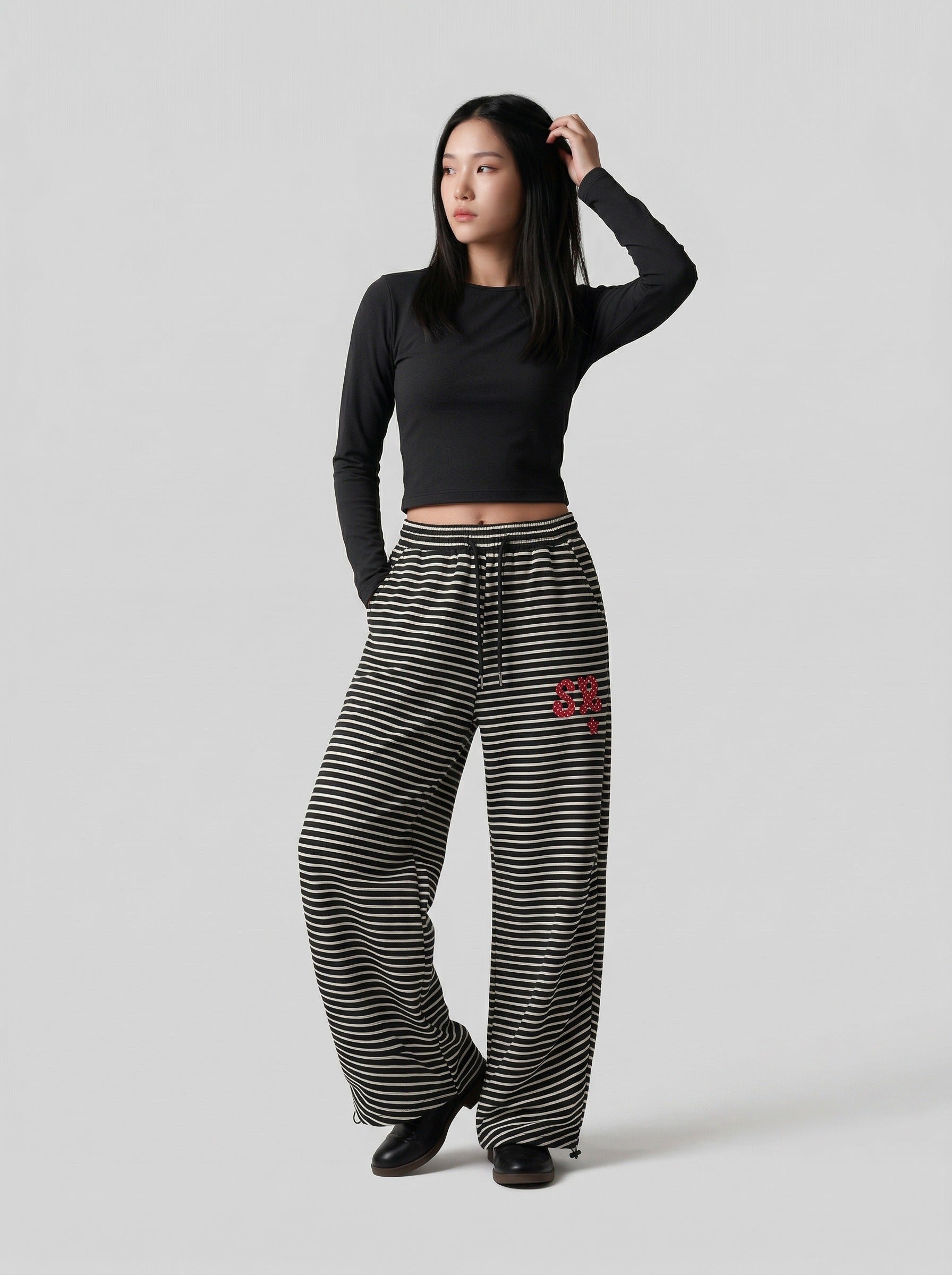 Pantalones de chándal de pierna ancha con rayas onduladas
